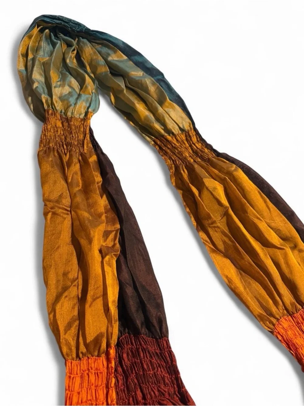 Orange, brown, and teal gradient silk scarf with fringe